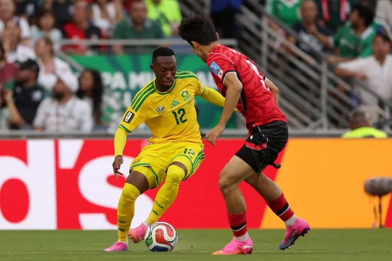South Africa's forward #12 Thapelo Maseko controls the ball as he's defended by South Korea's defender #03 Lee Gi-hyuk during the 2026 World Cup Group A football match between South Africa and South Korea at the Monterrey Stadium in Guadalupe, Mexico, on June 24, 2026.