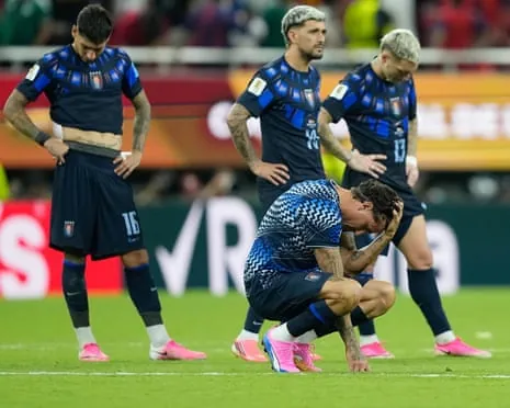 Uruguay players slump after defeat to Spain