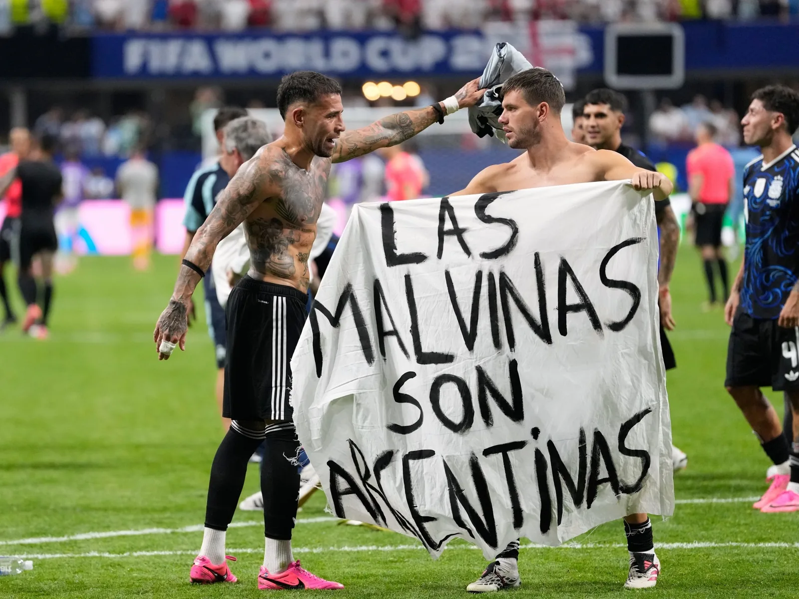 Argentina players display Falklands banner after World Cup semi-final win against England