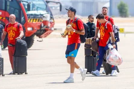 Rodri carries the World Cup at Barajas airport on Monday