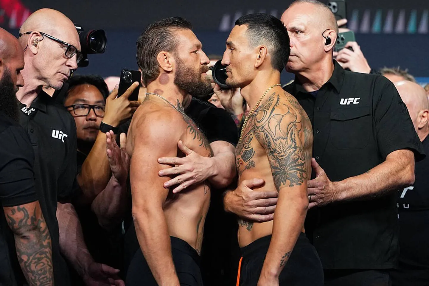 LAS VEGAS, NEVADA - JULY 10: (L-R) Conor McGregor and Max Holloway face off during the UFC 329 ceremonial weigh-in at T-Mobile Arena on July 10, 2026 in Las Vegas, Nevada. (Photo by Jeff Bottari/Zuffa LLC)