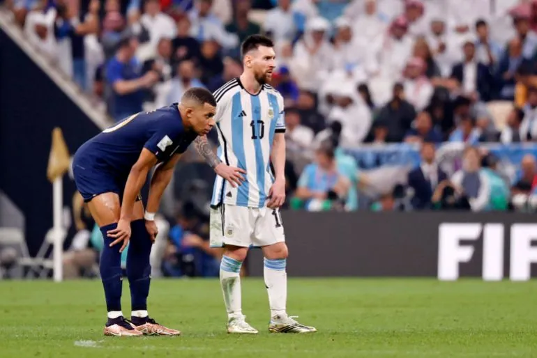 France forward Kylian Mbappe (10) stands next to Argentina forward Lionel Messi (10) before the start of extra time of the 2022 World Cup final